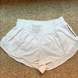 White reflective Lululemon shorts